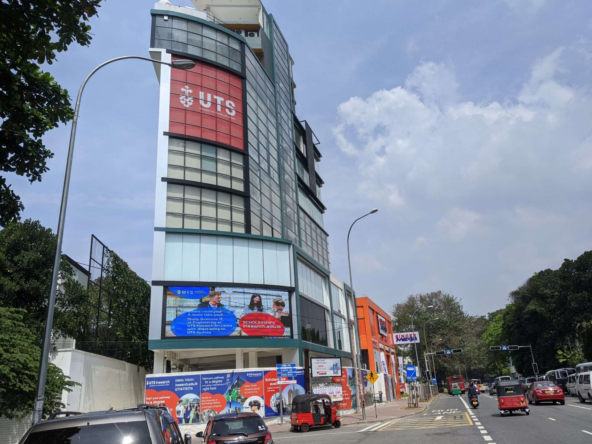 UTS Sri Lanka campus sign on a busy street in Colombo, Sri Lanka